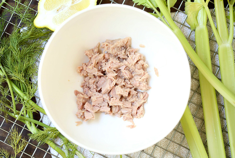 Tuna, drained and placed in a white mixing bowl