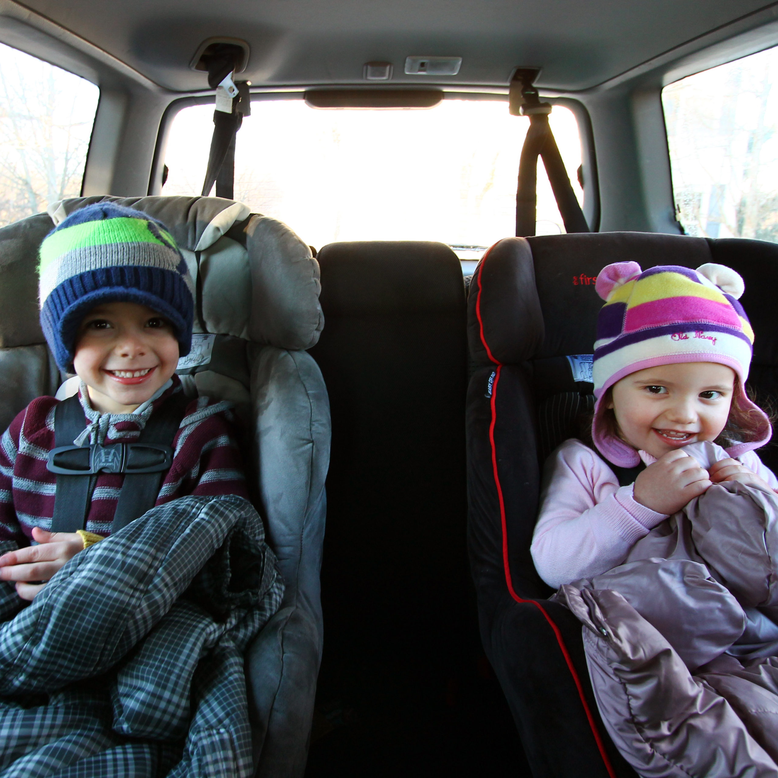 should kids where a winter coat in their car set