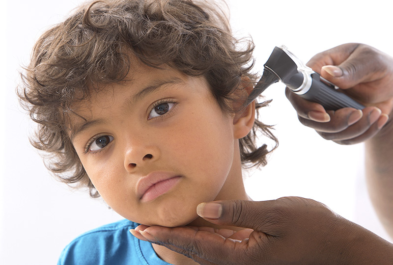 Young boy getting ear tubes checked
