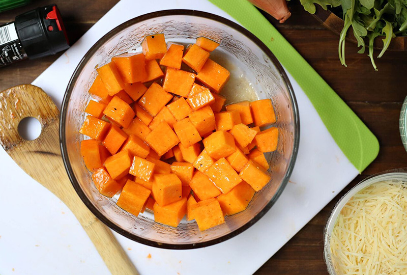 Diced butternut squash in a mixing bowl 