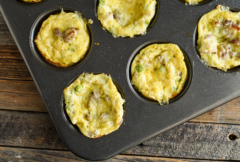 Egg and sausage muffins cooling in metal muffin pan