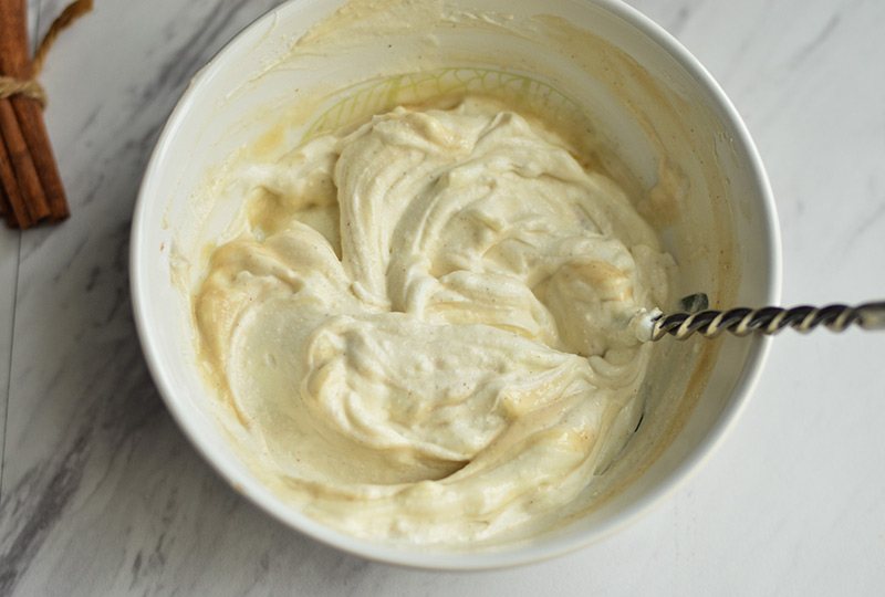 Peanut butter Greek yogurt dip being mixed in a bowl.