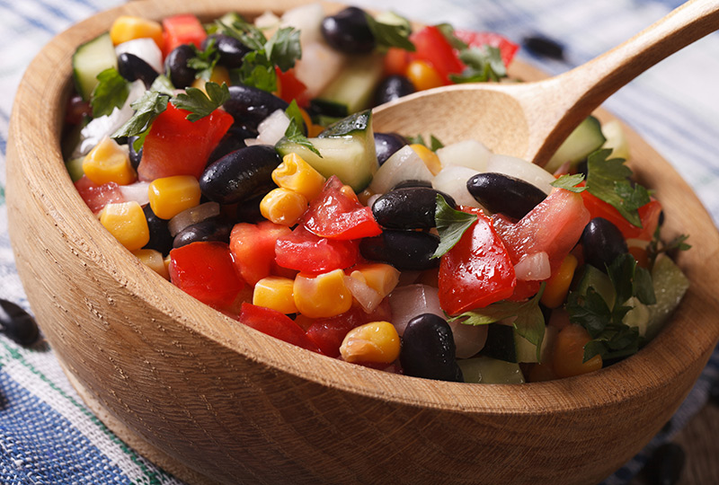 Bowl of tomato salsa with corn and black beans