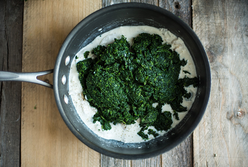 Spinach in pot with melted cream cheese