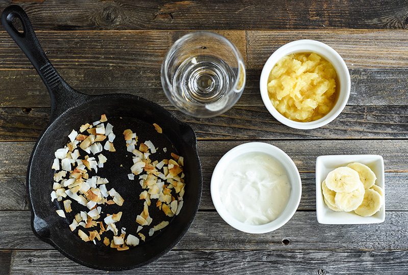 Ingredients for yogurt parfait displayed in bowls