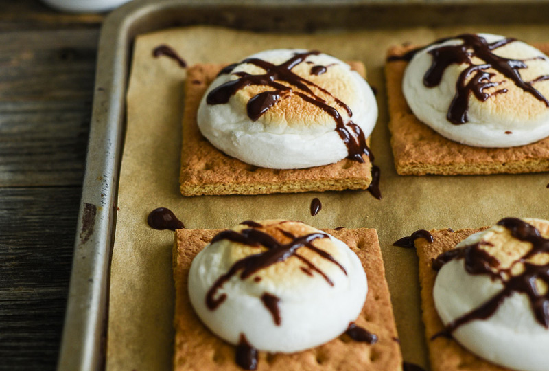 S'mores, baked in the oven and newly drizzled with chocolate.