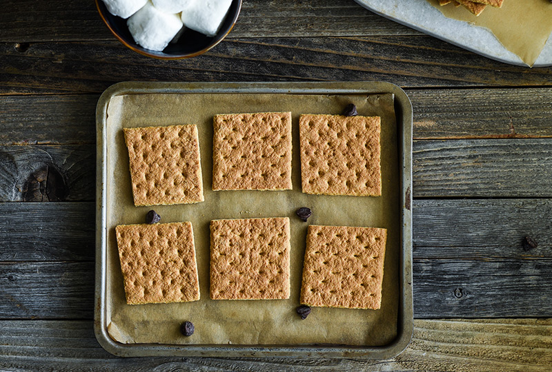 Graham crackers laid out on a baking pan