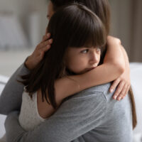 Parent hugging child