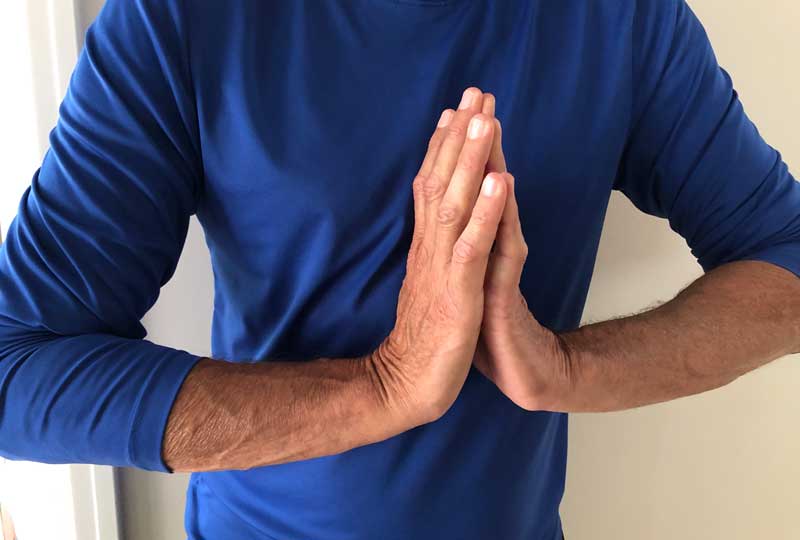 Person performing prayer stretch
