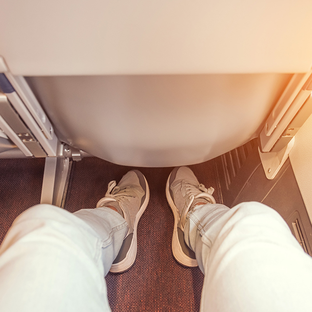 Legs in airplane seat